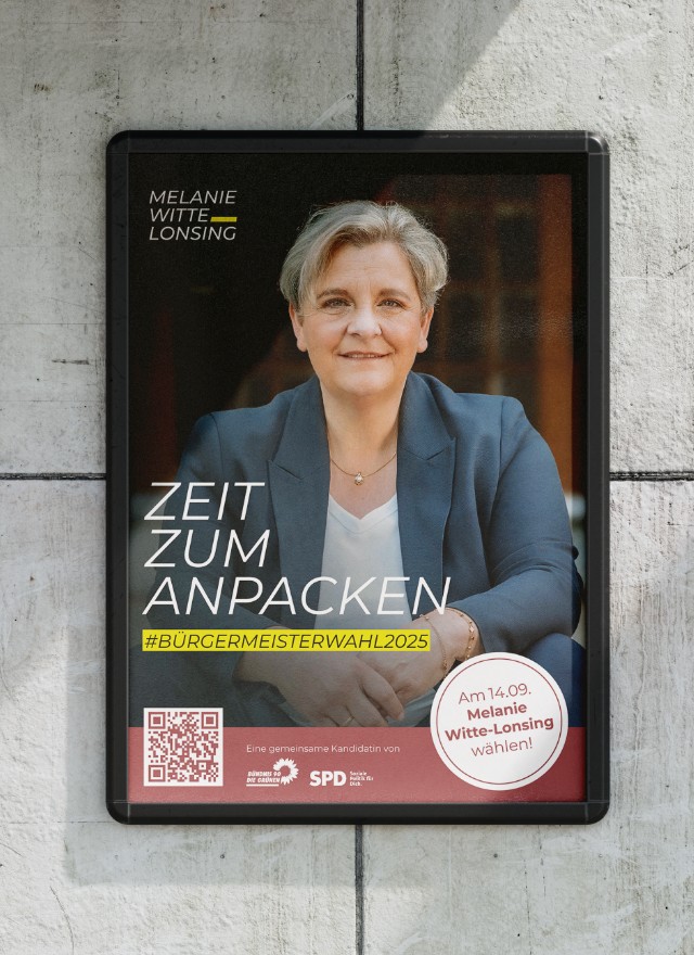 Wahlplakat „Zeit zum Anpacken" an einer Betonwand